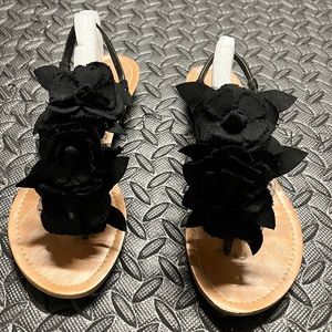 Black flat sandals with flowers